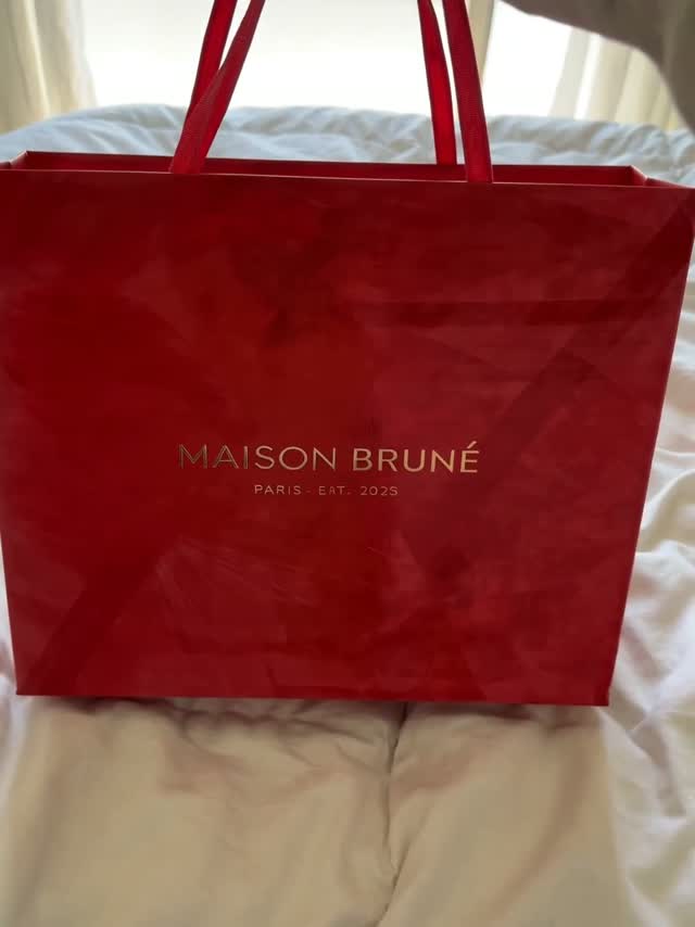 A close-up luxury bag reveal.