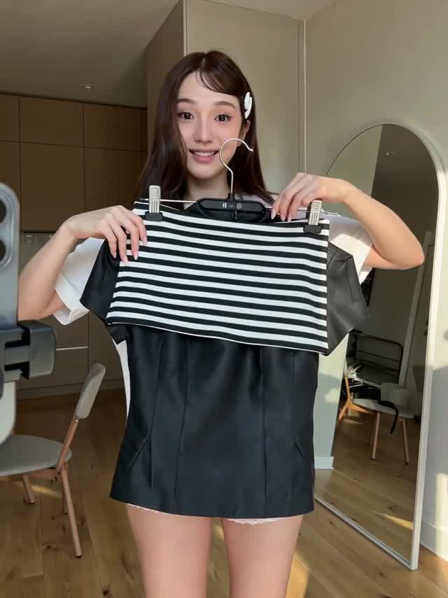 A fashion try-on with a striped top.